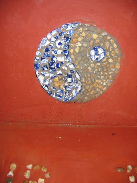 A close-up view of one of the ceramic fragments and river rock relief details