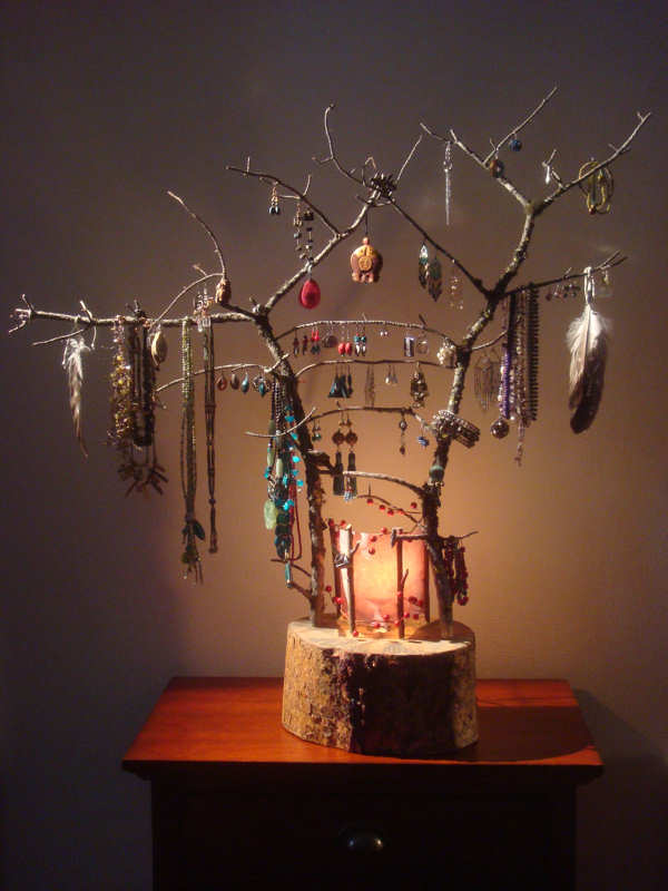 The perfect way to display your jewelry... with this sculptural stand crafted from twigs and log